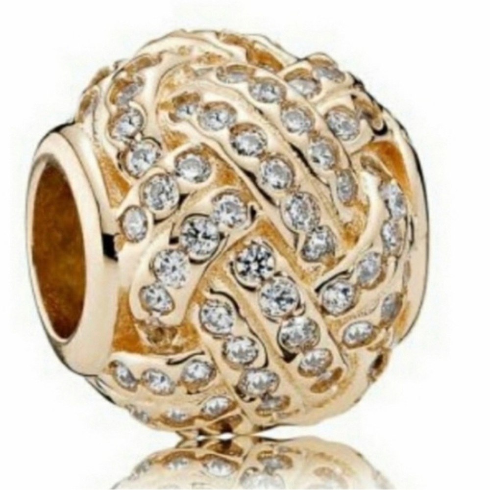 Pandora Retired  Love knot 14k yellow gold.